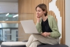   Save Download Preview Pensive thoughtful middle-aged woman looking at laptop screen reading document while working in coworking space, female freelance writer using computer writing online content. Mature freelance worker