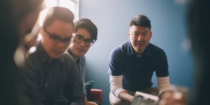 Three professionals having a meeting